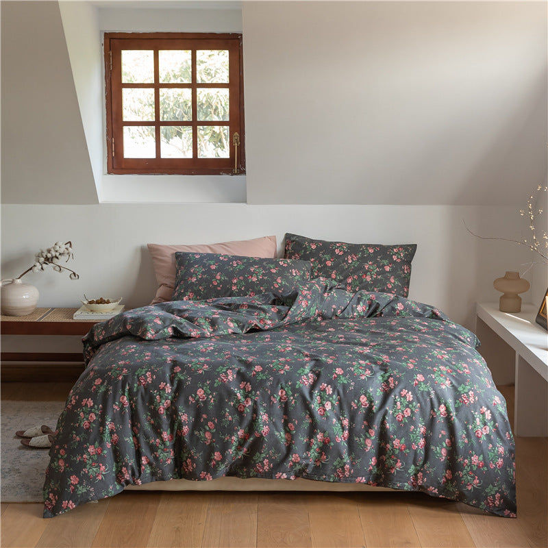 Aerial view of the VibeCore Cottagecore Black Floral Duvet Cover Set, showcasing intricate floral patterns on a dark background, adding an aesthetic, nature-inspired charm to your bedroom or dorm decor.