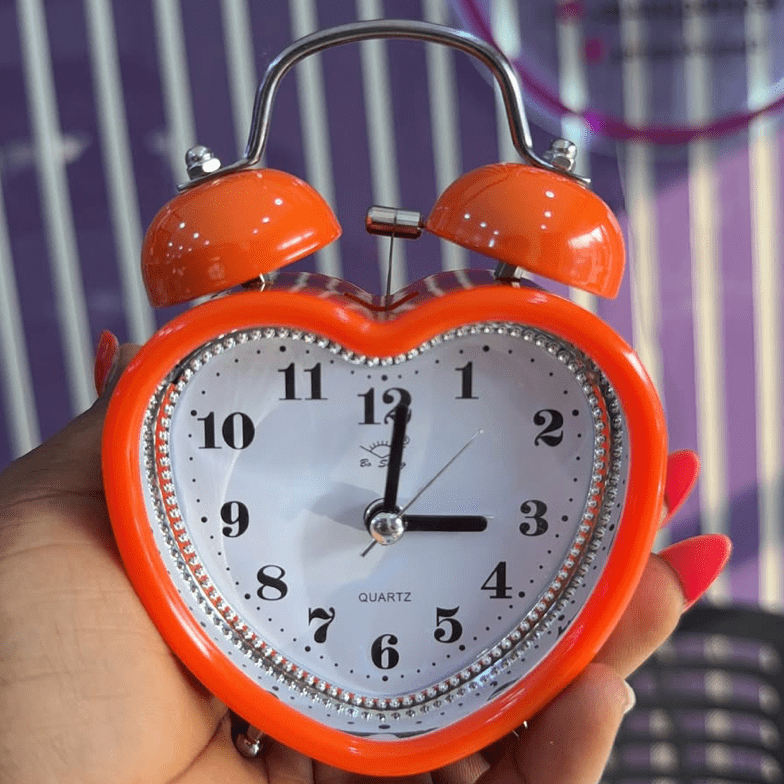 Heart Retro Alarm Clock Orange Being Held
