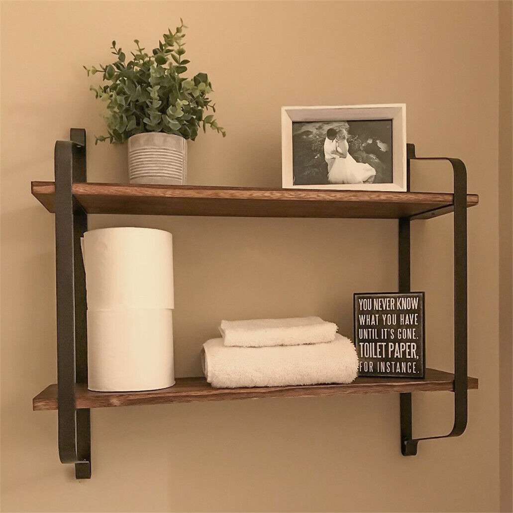 Angled view in a bathroom, showcasing its sturdy Paulownia wood and black matte steel design, perfect for organizing toiletries and decor. Keywords: 2-tier shelf, rustic floating shelf, bathroom storage, industrial decor, Paulownia wood, matte steel, bathroom organizer, home decor, sturdy shelf, versatile storage.