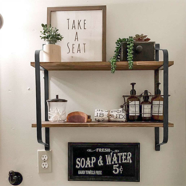 Another view above a toilet, showcasing the sturdy Paulownia wood shelves and black matte steel frame, ideal for organizing bathroom essentials. Keywords: 2-tier shelf, rustic floating shelf, bathroom storage, above toilet, Paulownia wood, matte steel, home decor, bathroom organizer, industrial decor, versatile shelf.