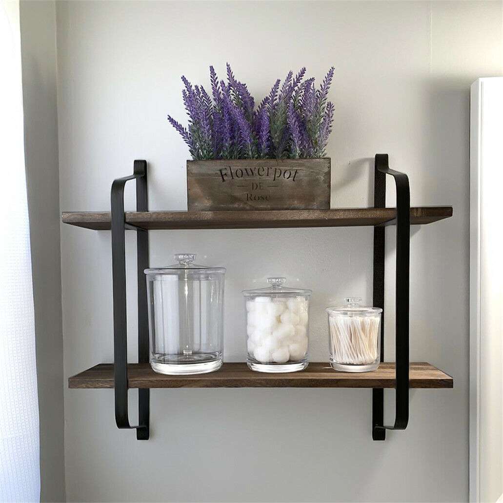 Displayed in a bathroom, this sturdy shelf is crafted from Paulownia wood and black matte steel. Perfect for organizing toiletries, plants, or decor. Ideal for rustic and industrial-inspired interiors. Keywords: 2-tier shelf, rustic wall shelf, bathroom organizer, floating shelf, industrial decor, Paulownia wood, matte steel, bathroom storage, home decor, versatile shelf.