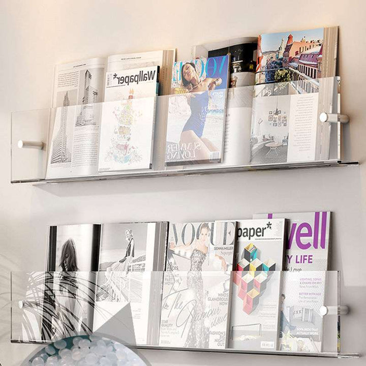VibeCore Acrylic Wall Mounted Floating Magazine Shelf in transparent, angled front view showcasing its minimalist design, perfect for displaying books, magazines, and decor.