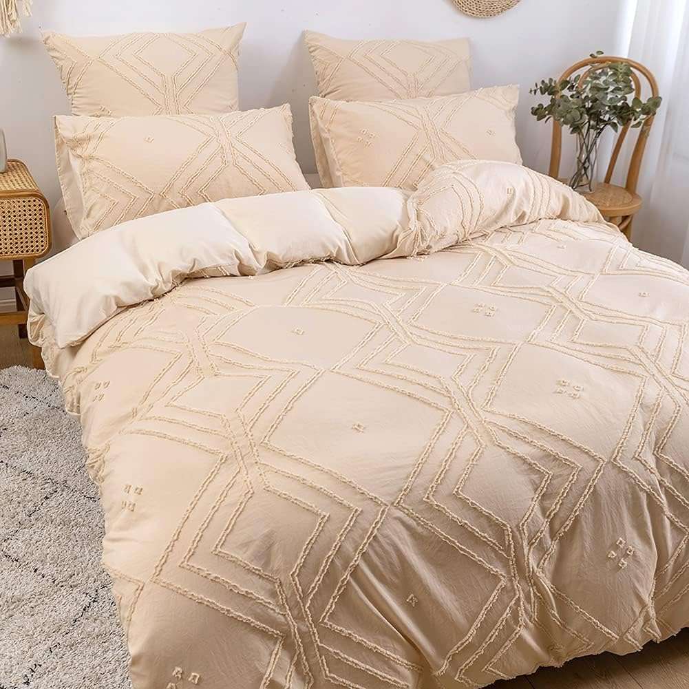 Angled front view of the VibeCore Aesthetic Free Spirit Tufted Duvet Cover Set in beige, showcasing its textured tufted pattern and inviting, cozy appeal. The soft fabric and warm, neutral tones create a laid-back, bohemian vibe perfect for any bedroom or dorm.