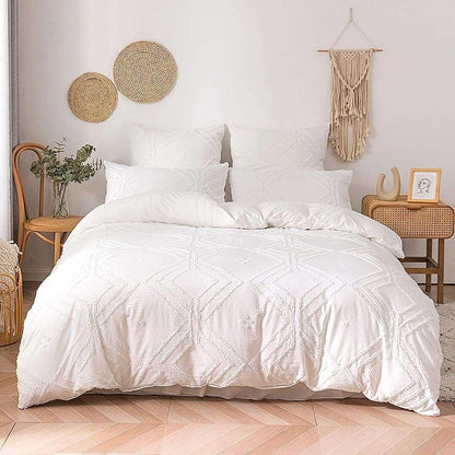 An aerial view of the VibeCore Aesthetic Free Spirit Tufted Duvet Cover Set in white, showcasing its intricate tufted pattern and soft, textured design. The cozy bedding brings a modern, boho vibe to your room with its plush feel and stylish aesthetic, creating the perfect space to relax and unwind.