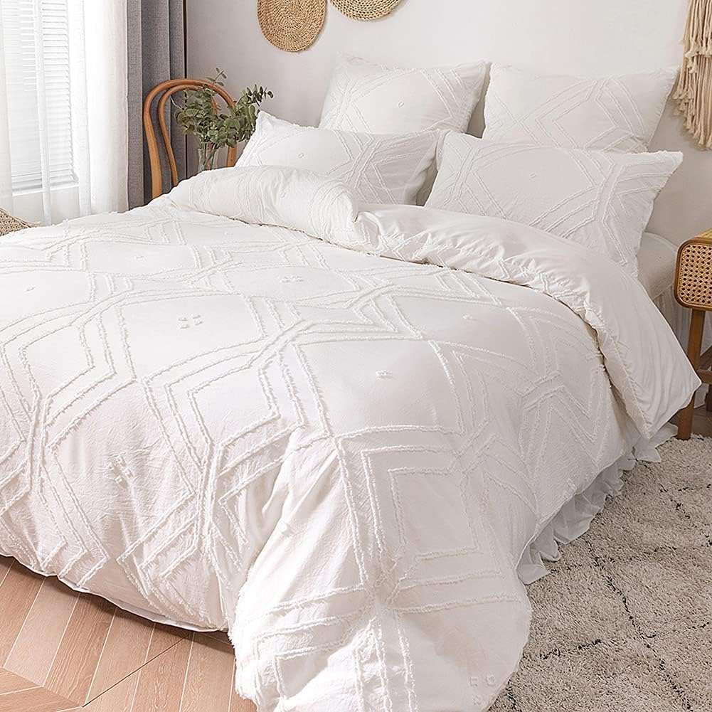 Angled aerial view of the VibeCore Aesthetic Free Spirit Tufted Duvet Cover Set in white, showcasing the detailed tufted texture and soft, inviting fabric. The modern boho design brings a cozy, artistic touch to your bedroom, perfect for creating a laid-back yet stylish space.