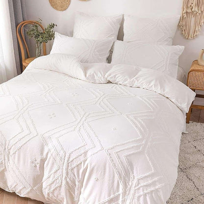 Close-up angled aerial view of the VibeCore Aesthetic Free Spirit Tufted Duvet Cover Set in white, highlighting the intricate tufted pattern and soft, textured fabric. This detailed shot emphasizes the cozy, boho-chic design, perfect for adding a touch of artistic flair and comfort to your bedroom or dorm.