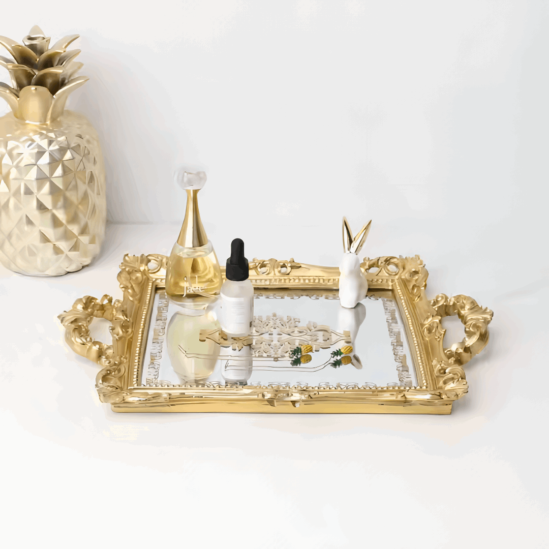 Front view of a luxurious gold mirror tray with detailed gold accents on the reflective surface, showcasing perfumes. Elegant and perfect for coquette aesthetic decor.