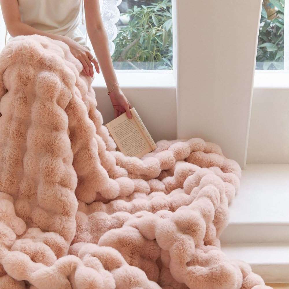 VibeCore Marshmallow Ultra Plush Blanket Blossom On Woman's Lap, demonstrating how soft and plush it is.
