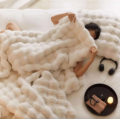 VibeCore Marshmallow Ultra Plush Blanket White Aerial View Over Girl, showcasing its luxurious texture and design.