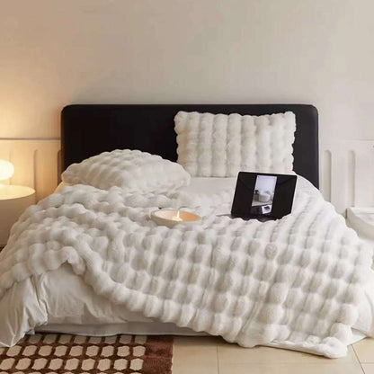 VibeCore Marshmallow Ultra Plush Blanket White On A Large Bed looking soft and luxurious.