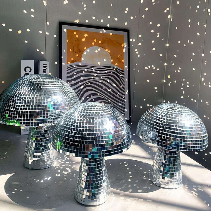 A VibeCore Mushroom Disco Ball in three sizes, reflecting vibrant light patterns. The varying sizes create a dynamic, playful lighting effect, adding a retro vibe and a touch of sparkle to the space.