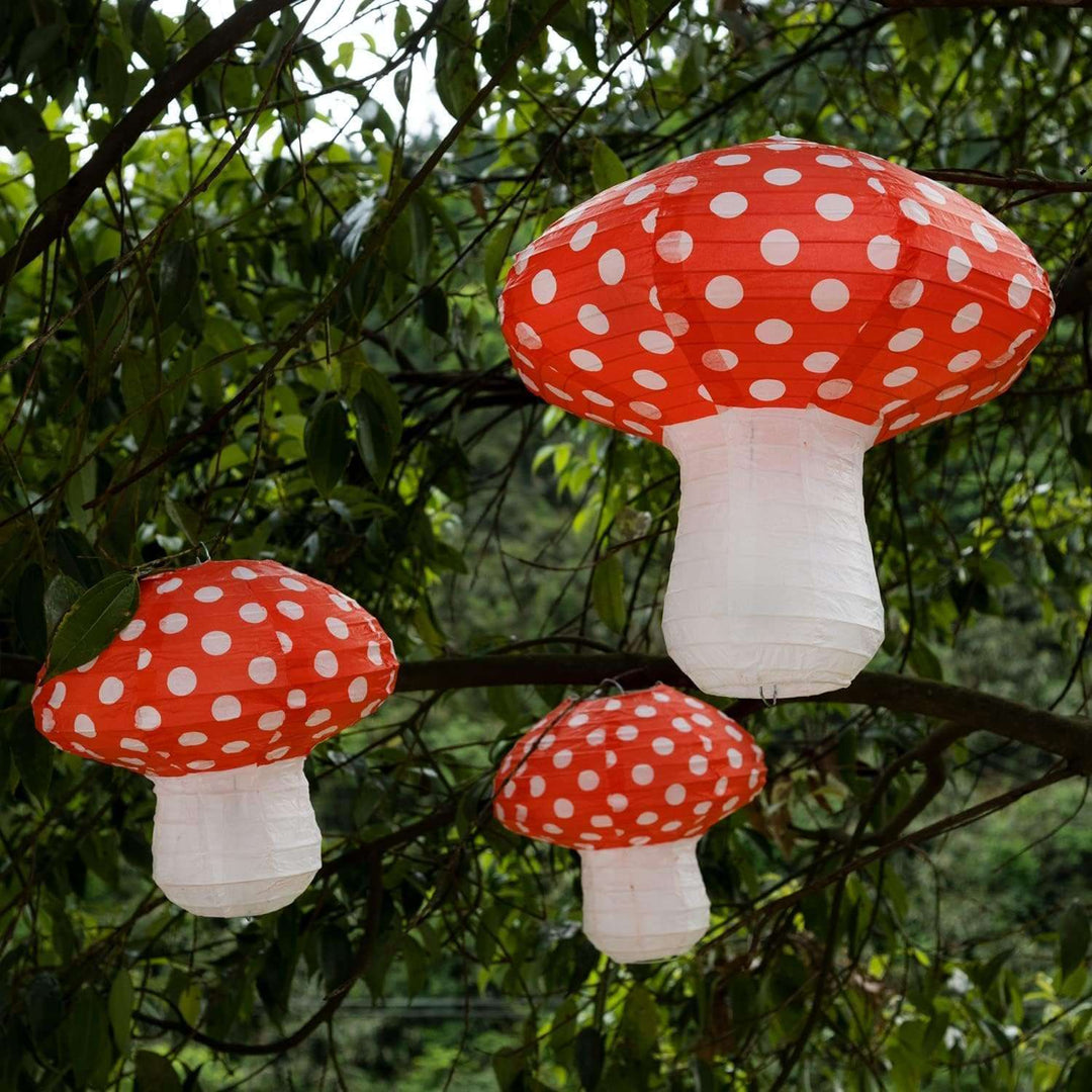VibeCore Mushroom Lantern Pendant hanging from a tree, showcasing its whimsical mushroom design with a soft, enchanting glow, adding a magical touch to any outdoor or indoor space.
