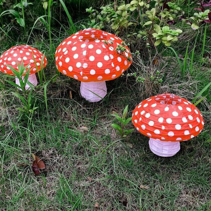 VibeCore Mushroom Lantern Pendant hanging in a yard, casting a charming glow and creating a whimsical, forest-inspired ambiance, perfect for outdoor gatherings and events.