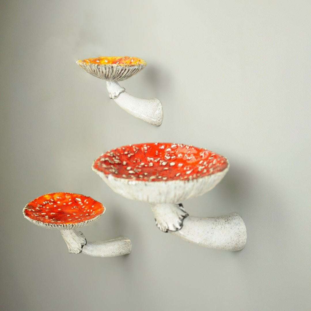 VibeCore Mushroom Wall Shelf in three different sizes, featuring charming mushroom-shaped design made from durable resin, perfect for displaying decor, candles, and trinkets.