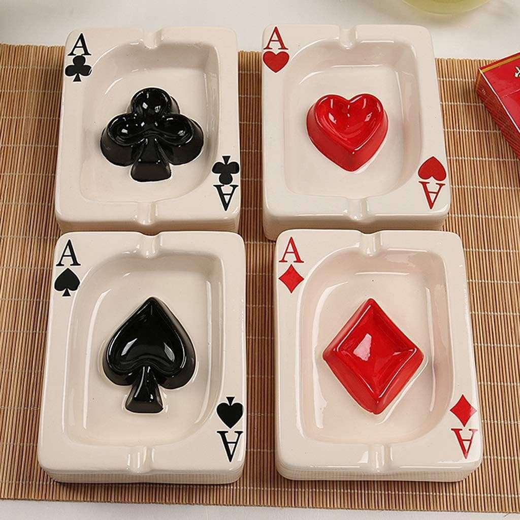 VibeCore Playing Card Ashtray collection, featuring all four card suit designs (Spades, Hearts, Diamonds, Clubs) in a close-up view, highlighting the glossy ceramic finish and quirky, card game-inspired style.