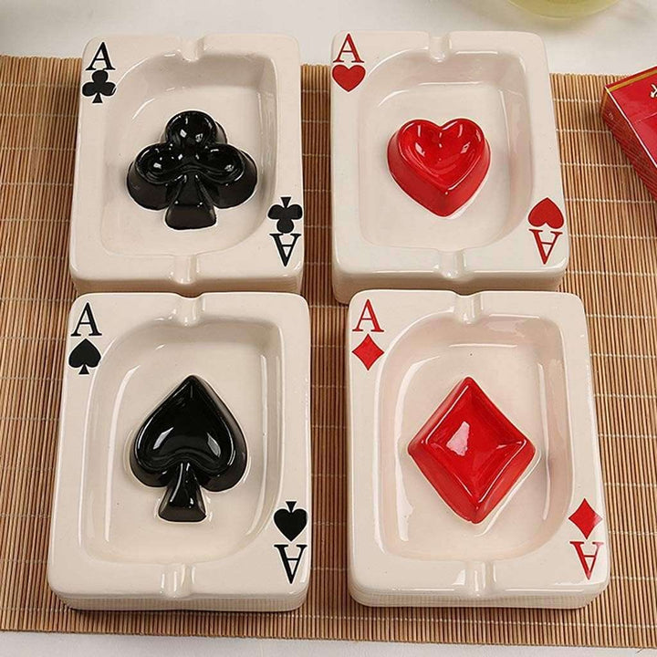 VibeCore Playing Card Ashtray collection, featuring all four card suit designs (Spades, Hearts, Diamonds, Clubs) in a close-up view, highlighting the glossy ceramic finish and quirky, card game-inspired style.
