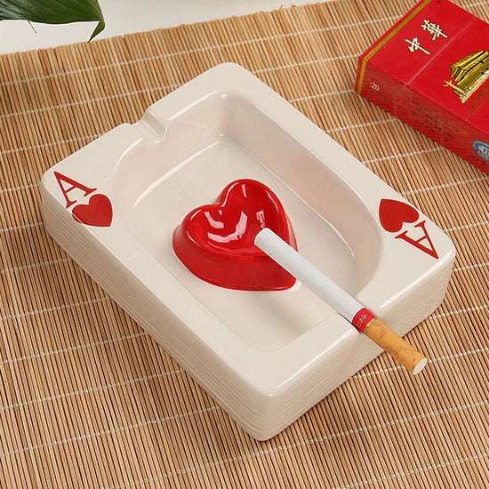 VibeCore Playing Card Ashtray in heart shape, featuring a fun, card game-inspired design. This quirky, ceramic ashtray with a glossy finish adds a playful and unique touch to your space, perfect for smokers or as a decorative piece.