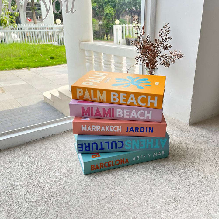 VibeCore Preppy Cities Fake Book Storage Box stacked on a table, featuring a stylish city-themed design. Perfect for organizing small items like jewelry or stationery while adding a chic and sophisticated touch to your decor.