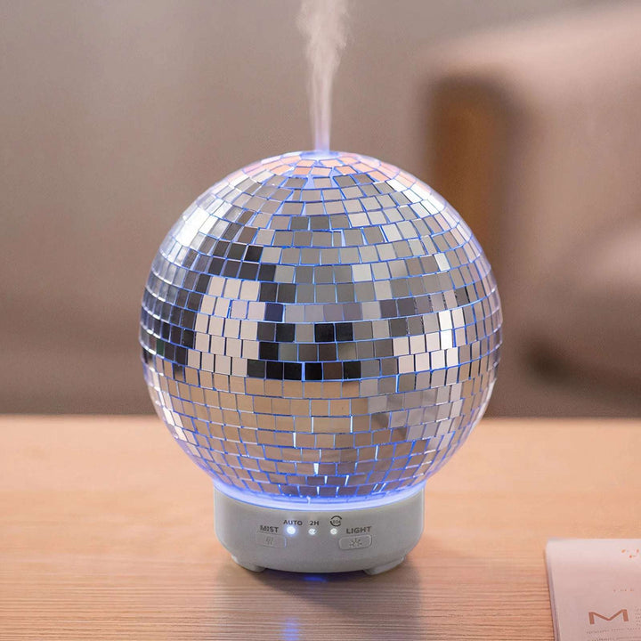 VibeCore Rotating Disco Ball Diffuser in action, with vibrant lights illuminating and diffuser mist filling the air, creating a dynamic and colorful ambiance.