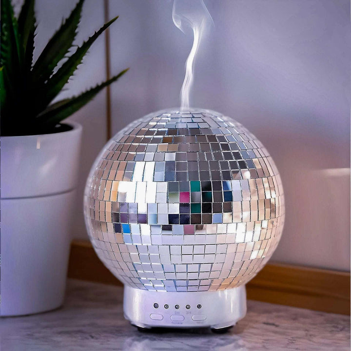 VibeCore Rotating Disco Ball Diffuser releasing a soothing mist, creating a calm and fragrant atmosphere with rotating light patterns.