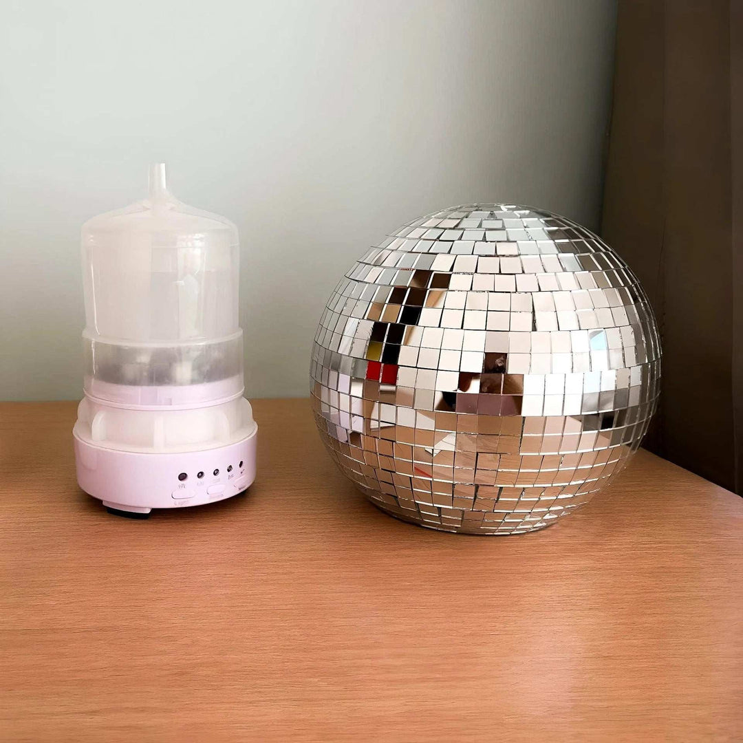 VibeCore Rotating Disco Ball Diffuser showing the water reservoir, designed for easy refills and extended use for continuous mist diffusion.