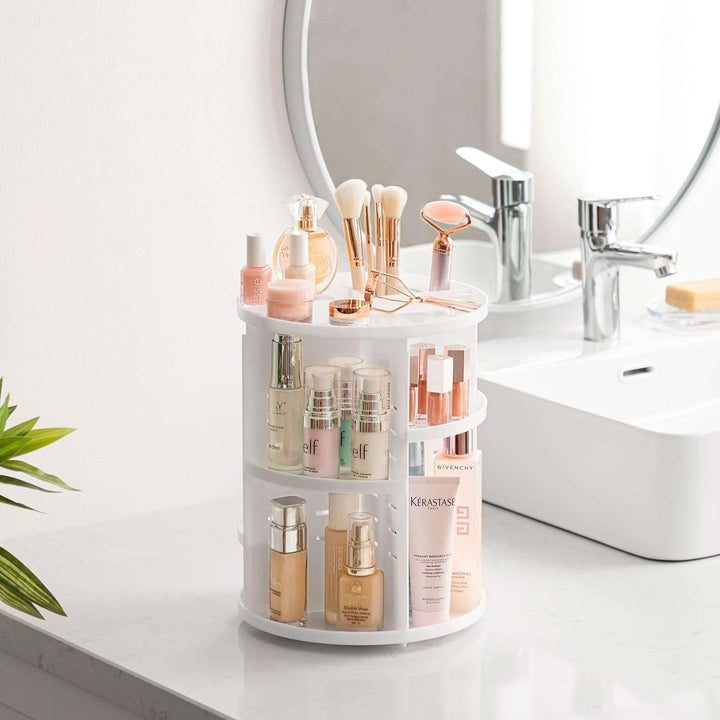 VibeCore Rotating Makeup Organizer in White, placed in a bathroom setting, showcasing its sleek design for organizing cosmetics, skincare, and beauty essentials with easy access.