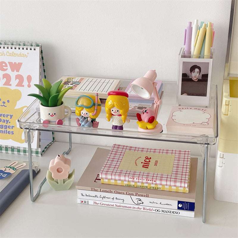 VibeCore Transparent Acrylic Foldable Shelf (alternative view) displaying one shelf on desk, organized with beauty products, minimalist design, space-saving storage, durable acrylic, modern and stylish, versatile use for vanity, office, or bathroom organization.