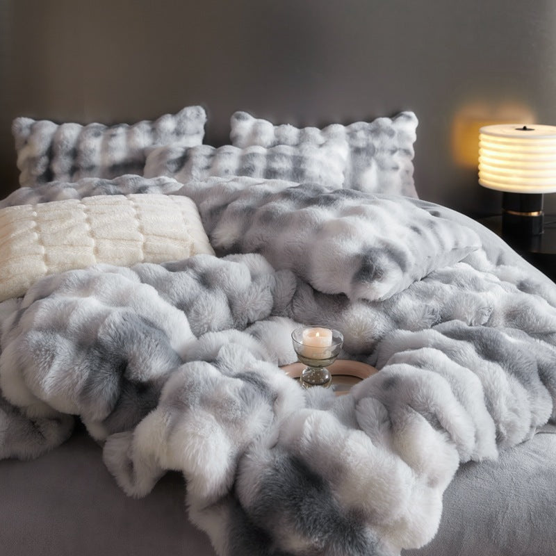 Front close-up photo of the 'Arctic Faux Fur Bedding Set' in Arctic Wolf, showcasing its luxurious, soft faux fur texture. The rich, warm gray and white color and plush fabric add a cozy, elegant touch to any bedroom, perfect for creating a stylish and inviting space.
