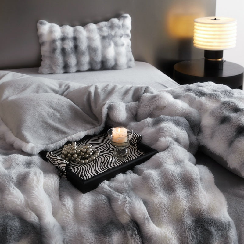 Close-up of the 'slept-in' Arctic Faux Fur Bedding Set in color Arctic Wolf, showing the soft, plush texture of the faux fur with relaxed folds and a cozy, lived-in look. The cool, neutral gray and white tones create a calming, stylish atmosphere in any bedroom or dorm.