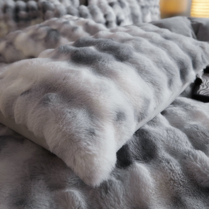 Close-up of the plush pillow cover from the 'Arctic Faux Fur Bedding Set' in Arctic Wolf, highlighting its soft, luxurious faux fur texture. The rich gray and white color and velvety feel add a cozy and elegant touch to any bedroom or dorm.

