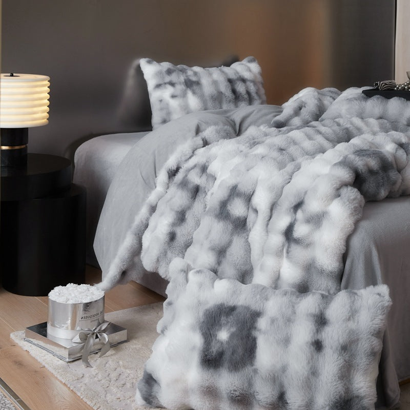 Side right view of the 'Arctic Faux Fur Bedding Set' in Arctic Wolf, showcasing its plush faux fur texture and rich, warm gray and white color. The bedding set exudes a cozy, luxurious vibe, perfect for adding comfort and style to any bedroom or dorm.