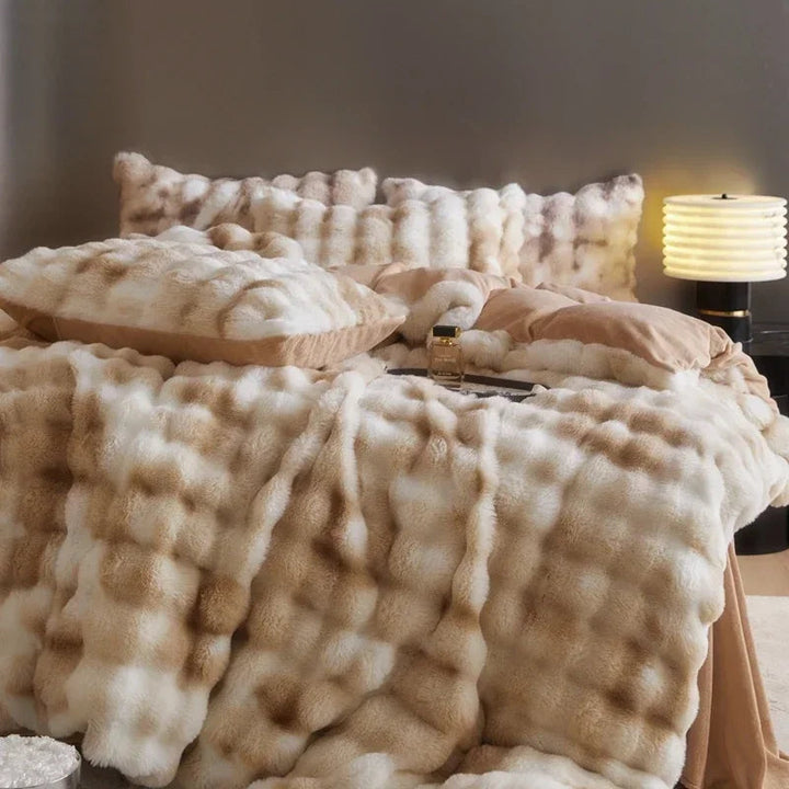 Close-up front view of the 'Arctic Faux Fur Bedding Set' in Peach Wood, showcasing its soft, plush faux fur texture and warm orange-brown and beige color. The luxurious fabric adds a cozy, stylish, and elegant touch to any bedroom or dorm.
