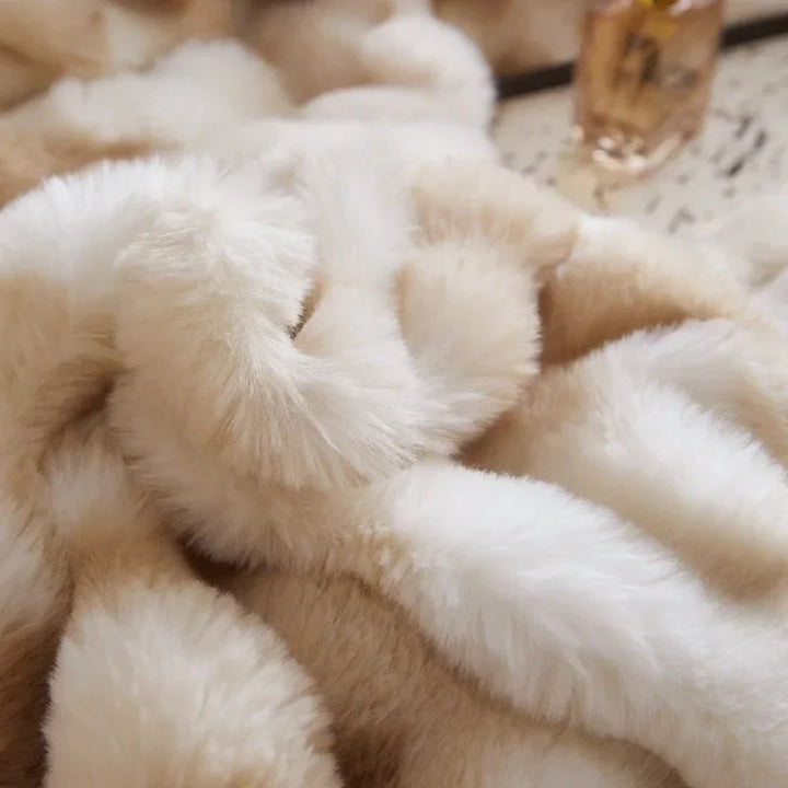 Close-up of the plush material used in the 'Arctic Faux Fur Bedding Set' in Peach Wood, highlighting its soft, luxurious faux fur texture. The warm, peachy orange-brown and white gradient color and velvety feel add an elegant and cozy touch to any bedroom or dorm.