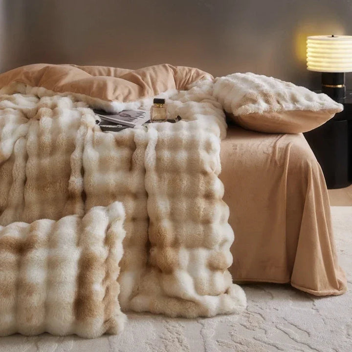Side view of the 'Arctic Faux Fur Bedding Set' in Peach Wood, showcasing its soft, luxurious faux fur texture and cool, neutral orange-brown and beige tones. The bedding exudes a cozy, elegant vibe, perfect for adding comfort and style to any bedroom or dorm.