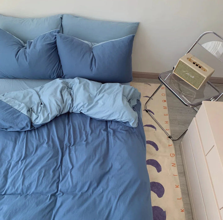 Aerial view of the VibeCore Aesthetic Australian Cotton Duvet Cover Set in blue, highlighting its smooth, breathable fabric and minimalist design. Crafted from premium Australian cotton, this duvet cover brings a refreshing pop of color to your bedroom, offering both comfort and style for a cozy, inviting space.
