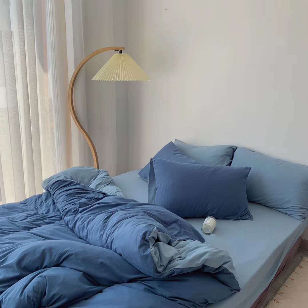 Aerial side view of the VibeCore Aesthetic Australian Cotton Duvet Cover Set in blue, showcasing its soft, breathable fabric and minimalist design. Crafted from premium Australian cotton, this duvet set brings a touch of elegance and ultimate comfort to any bedroom or dorm, perfect for year-round use.