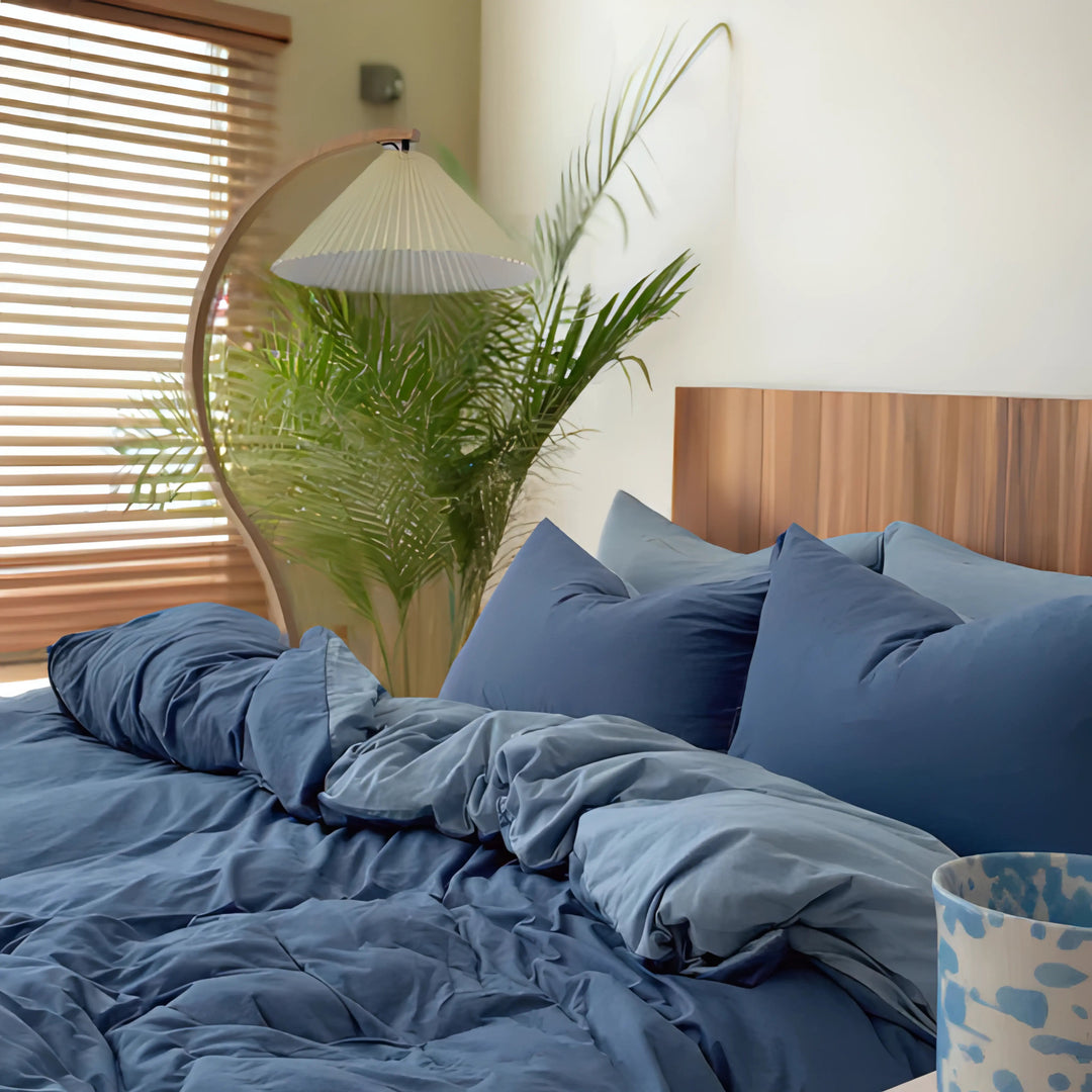 Side view of the VibeCore Aesthetic Australian Cotton Duvet Cover Set in blue, showcasing the luxurious texture and premium Australian cotton fabric. The clean, minimalist design and rich blue color add an elegant touch to any bedroom, combining comfort and style for a timeless, cozy retreat.