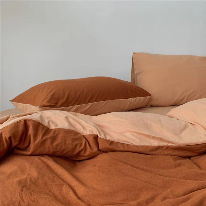 Close-up of the VibeCore Aesthetic Australian Cotton Duvet Cover Set in burnt orange, showcasing the premium Australian cotton fabric and the vibrant, warm hue. The soft texture and rich color highlight the duvet's luxurious feel, adding a cozy and sophisticated touch to your bedroom decor.
