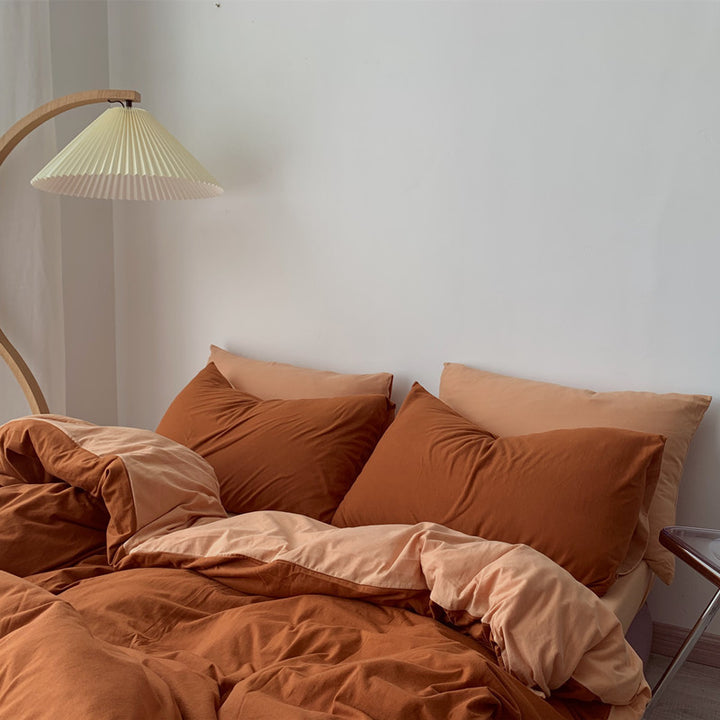 Side aerial view of the VibeCore Aesthetic Australian Cotton Duvet Cover Set in burnt orange, highlighting the soft, premium cotton fabric and vibrant color. The warm, earthy tone adds a cozy and inviting atmosphere to your bedroom, offering luxurious comfort and timeless style for any season.