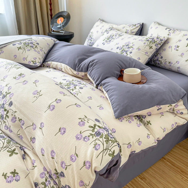 Angled aerial view of the VibeCore Aesthetic Blooming Lilacs Duvet Cover Set, featuring delicate lilac floral patterns and soft, luxurious fabric that enhances the cozy, vibrant ambiance of your bedroom or dorm.