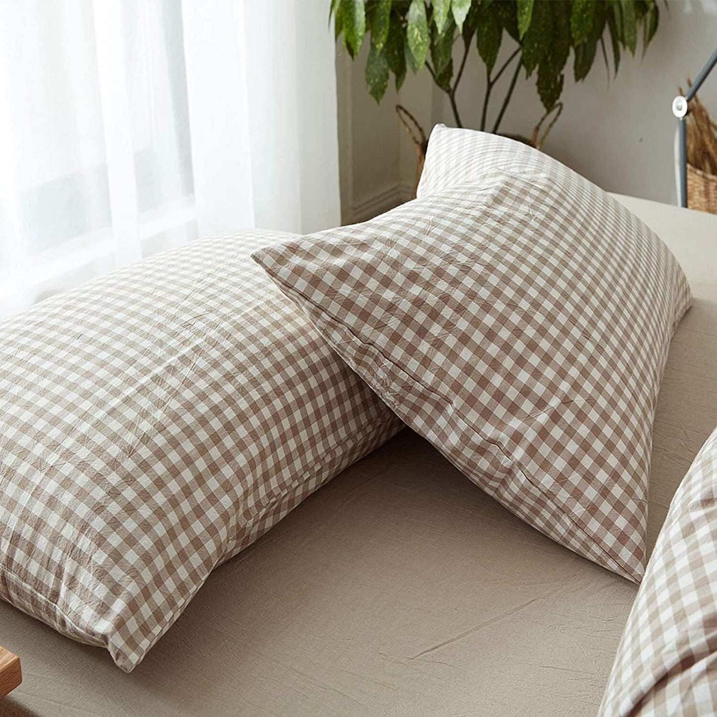 Close-up of VibeCore Aesthetic Brown Gingham Duvet Cover Set pillowcases, featuring a classic brown gingham check pattern with a soft and breathable fabric for a cozy, aesthetic touch to your bed.