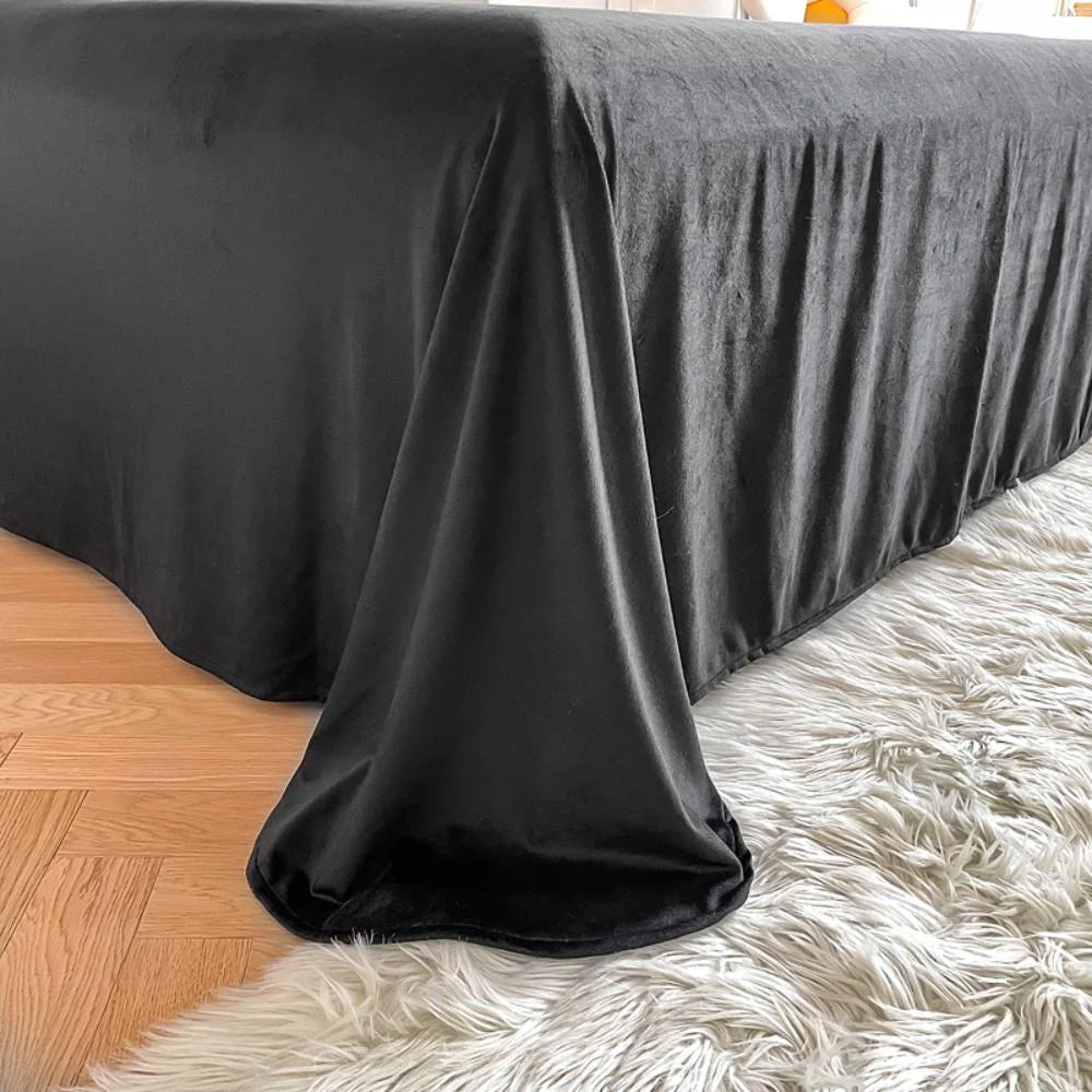 Close-up of the sheet from the VibeCore Cloud 9 Fleece Bedding Set in the color Black, featuring ultra-soft fleece fabric for superior comfort and warmth. Perfect for creating a cozy, luxurious sleep experience and adding sleek, modern style to your bedroom or dorm.