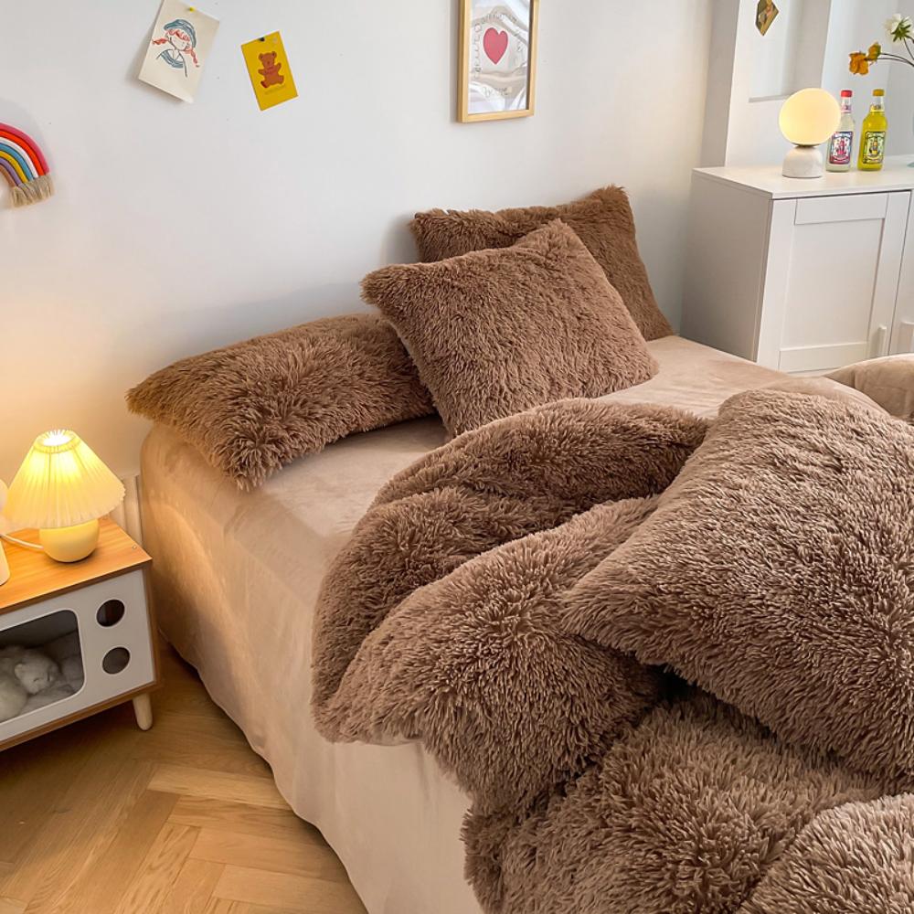 Left angle view of the VibeCore Cloud 9 Bedding Set in the color Brown, featuring ultra-soft fleece fabric for unmatched comfort and warmth. This cozy bedding set adds a touch of luxury and style to your bedroom or dorm, perfect for relaxing and unwinding after a long, cold day.