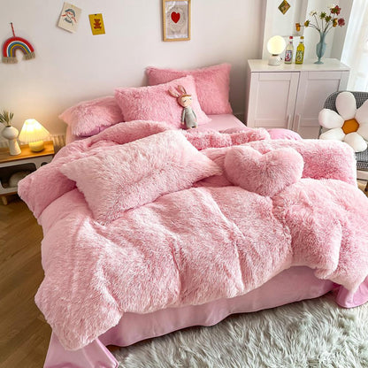 Left angle view of the VibeCore Cloud 9 Bedding Set in the color Light Pink, featuring ultra-soft fleece fabric for unmatched comfort and warmth. This cozy bedding set adds a touch of luxury and style to your bedroom or dorm, perfect for relaxing and unwinding after a long, cold day.