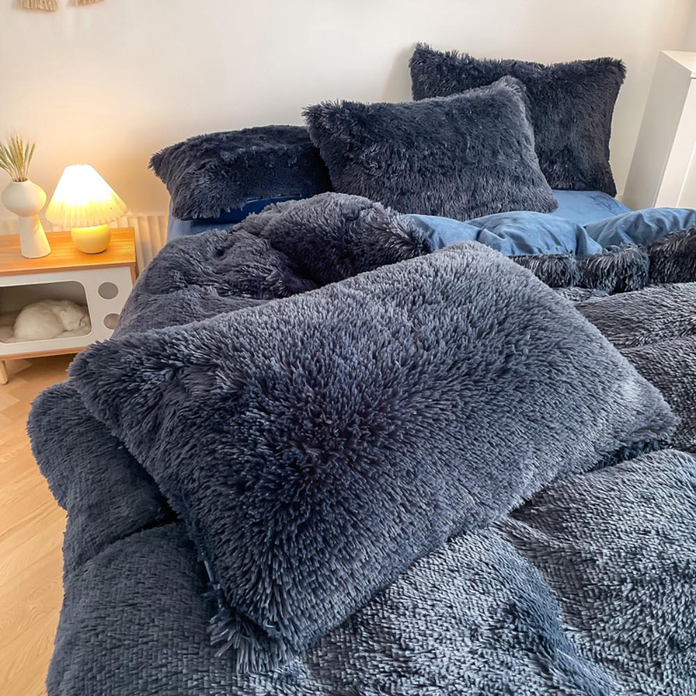 Close-up of the pillow cover and duvet from the VibeCore Cloud 9 Bedding Set in the color Navy Blue, showcasing ultra-soft fleece fabric for exceptional comfort. This cozy, luxurious bedding set adds warmth and style to your bedroom or dorm, perfect for staying warm, relaxing, or enhancing your space.