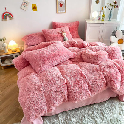 Left angle view of the VibeCore Cloud 9 Bedding Set in the color Pink, featuring ultra-soft fleece fabric for unmatched comfort and warmth. This cozy bedding set adds a touch of luxury and style to your bedroom or dorm, perfect for relaxing and unwinding after a long, cold day.