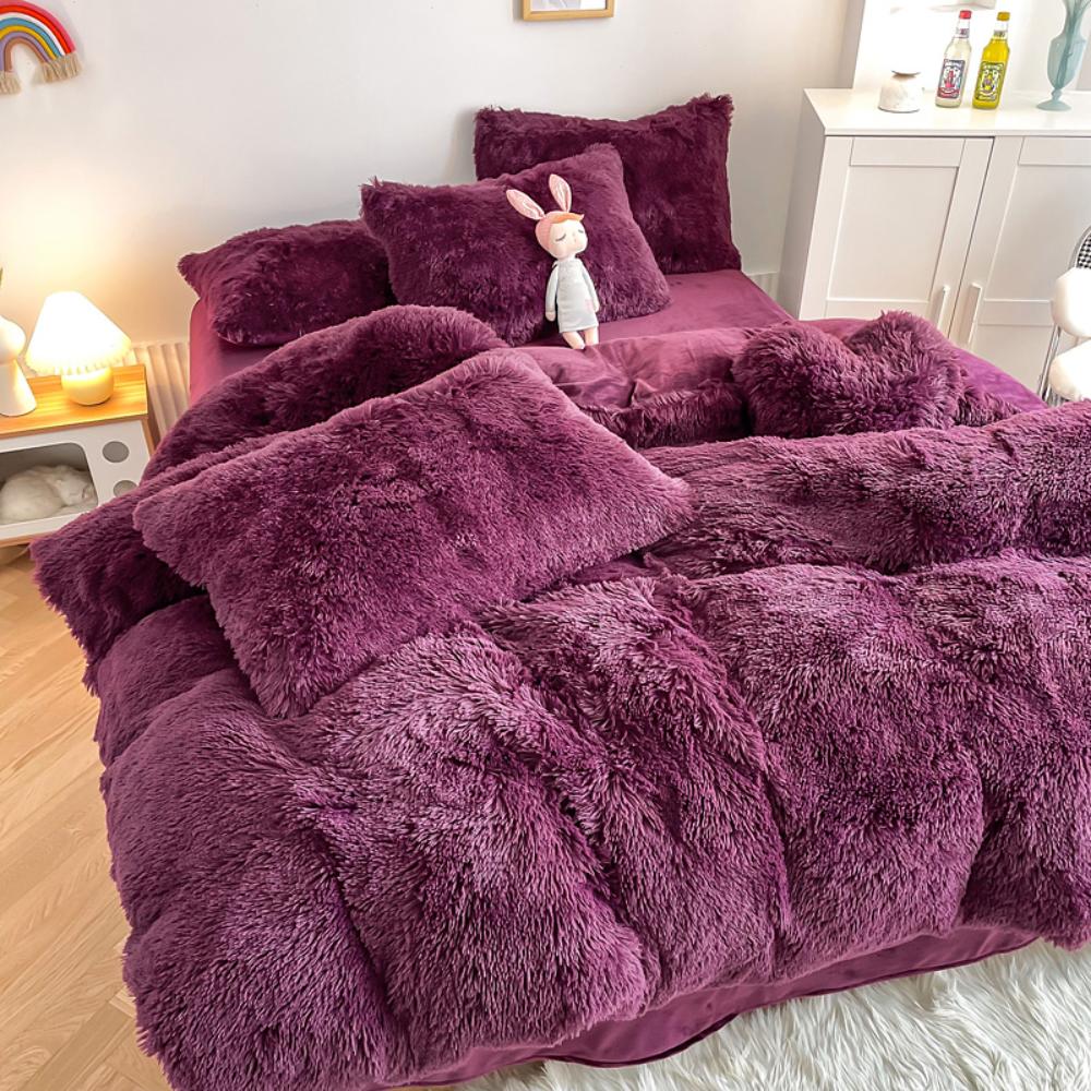 Left angle view of the VibeCore Cloud 9 Bedding Set in the color Purple, featuring ultra-soft fleece fabric for unmatched comfort and warmth. This cozy bedding set adds a touch of luxury and style to your bedroom or dorm, perfect for relaxing and unwinding after a long, cold day.
