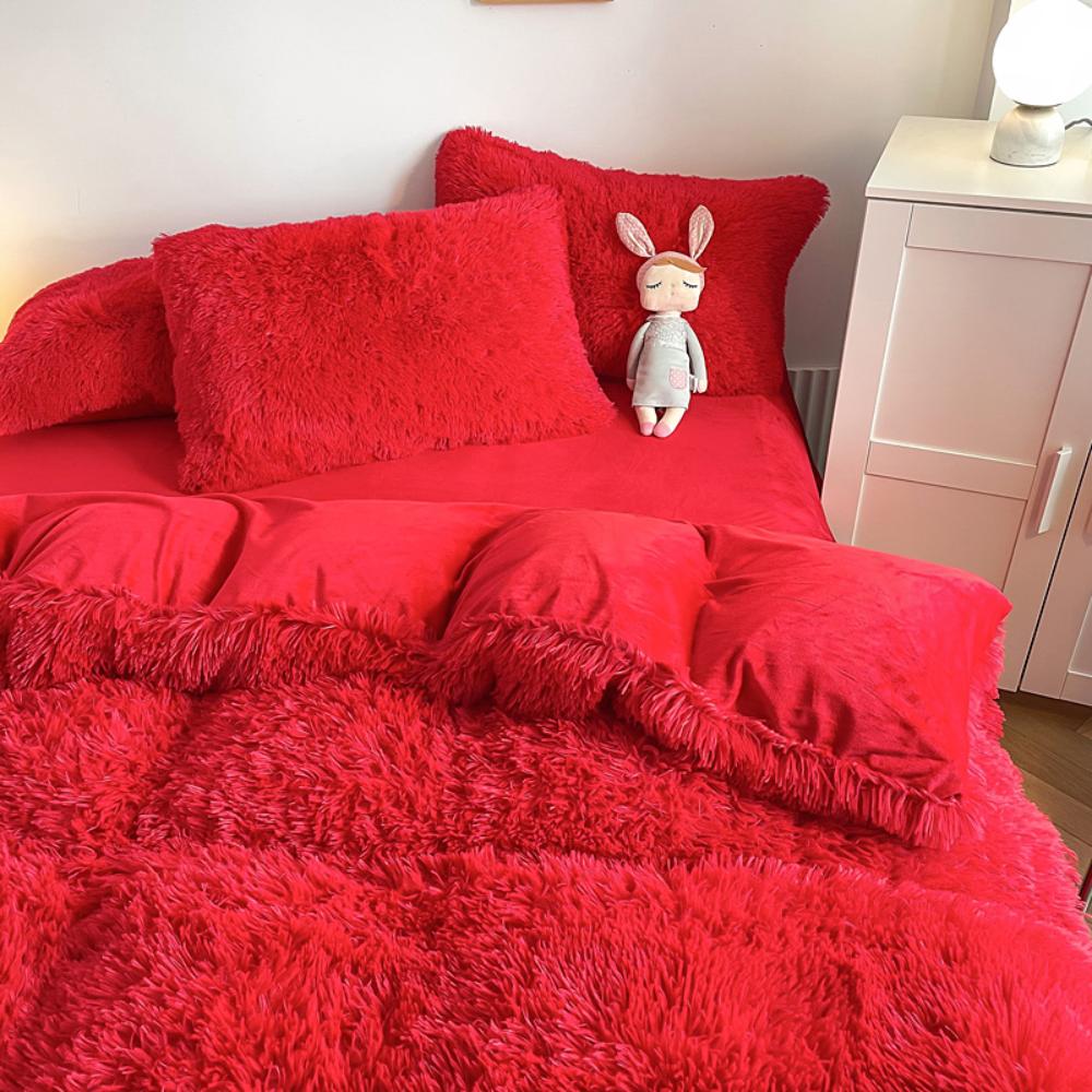 Another side angle of the VibeCore Cloud 9 Fleece Bedding Set in the color Red, showcasing its ultra-soft fleece fabric for ultimate comfort and cozy warmth. Ideal for creating a fresh, inviting atmosphere in your bedroom or dorm, this bedding set adds both luxury and style.