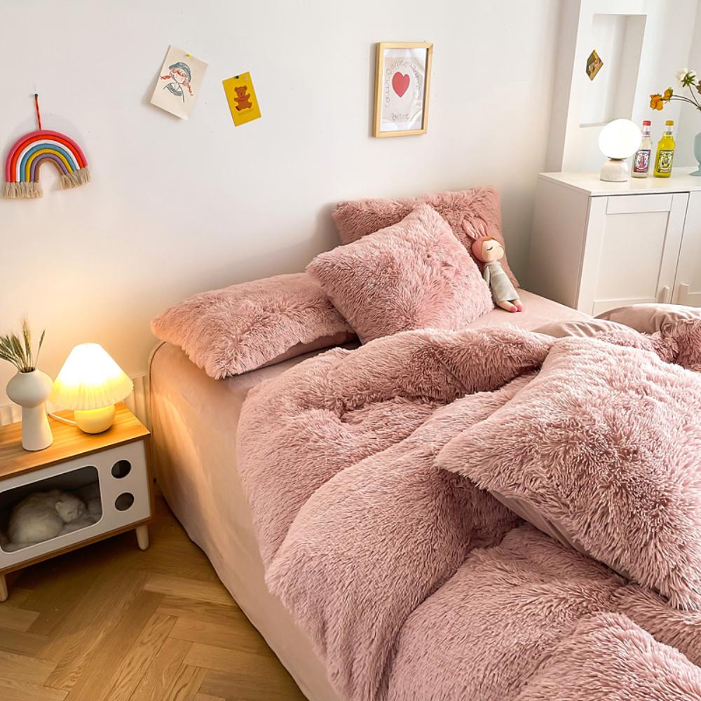 Alternative full side angle of the VibeCore Cloud 9 Bedding Set in the color Rose, featuring ultra-soft fleece fabric for ultimate comfort and luxurious warmth. This bedding set adds cozy style to your bedroom or dorm, perfect for creating a relaxing and inviting atmosphere.