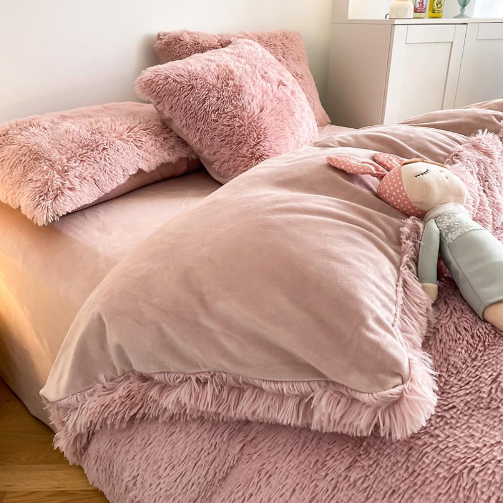 Close-up of the duvet cover from the VibeCore Cloud 9 Bedding Set in the color Rose, featuring ultra-soft fleece fabric for ultimate comfort and cozy luxury. Perfect for adding warmth, style, and a plush feel to your bedroom or dorm, ideal for sleeping or relaxing.